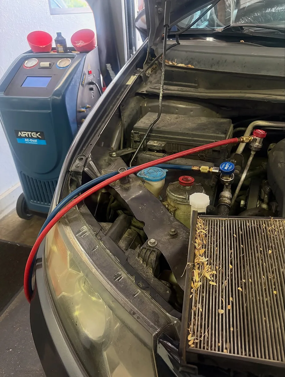 Vehicle air-conditioning service in progress at Mesa Auto & Fleet